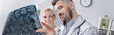 positive doctor looking at brain mri Stock Photo