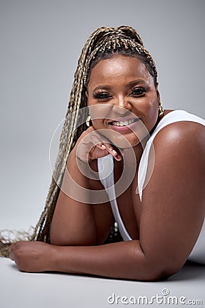 Positive Emotions Concept. Portrait of excited chubby black woman smiling, laughing Stock Photo