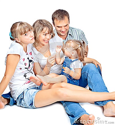 Positive family of four sitting and talking Stock Photo