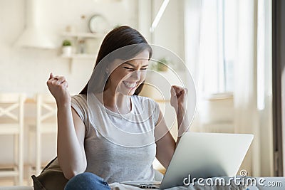 Young woman happy about good news received by email Stock Photo