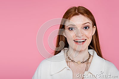 Positive freckled woman in jacket and Stock Photo