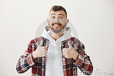 Positive friendly boyfriend cheer up, assuring that everything will be great. Handsome guy with stylish haircut and Stock Photo