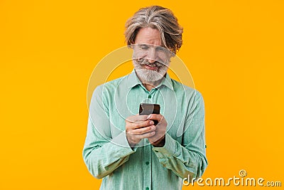 Positive grey-haired bearded man Stock Photo