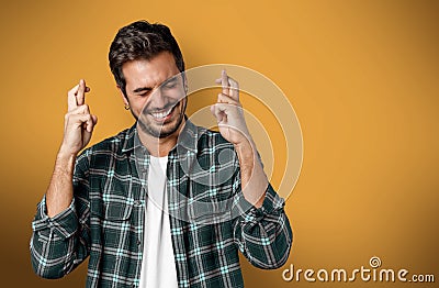 Positive guy wishing his dream comes true Stock Photo