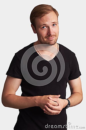 Positive handsome man in black t-shirt. Isolated Stock Photo