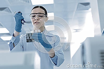 Positive nice woman doing a test Stock Photo