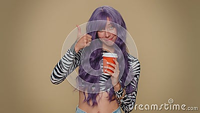 Positive pretty woman drinking coffee from cup, enjoying hot beverage in papercup, holding espresso Stock Photo