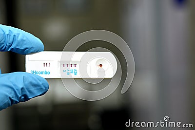 Positive result of HIV AIDS, HCV and positive HBV in a rapid test cassette kit for Hepatitis C virus, HIV and HBV Stock Photo