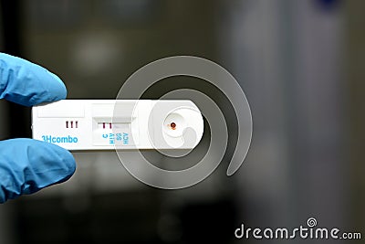 Positive result of HIV AIDS and negative HCV and HBV in a rapid test cassette kit for Hepatitis C virus antibodies HCV AB Stock Photo