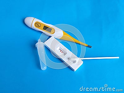 positive result virus Covid-19 rapid fast test sars-cov-2 antigen saliva slobber thermometer Stock Photo