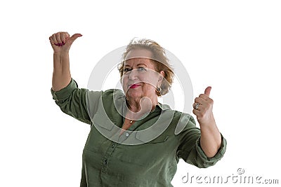 Positive senior woman giving thumbs up Stock Photo
