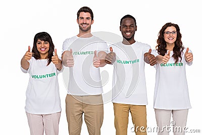 Positive teamwork smiling with thumbs up Stock Photo