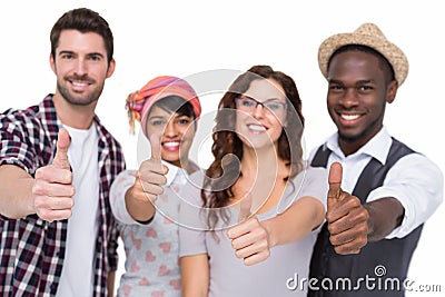 Positive teamwork smiling with thumbs up Stock Photo