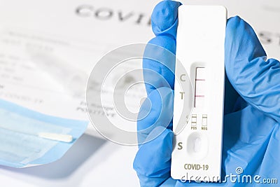 Positive test result using the COVID-19 rapid testing device, antibody sample to the patient's rapid swab serology. Stock Photo