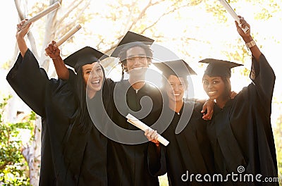 Positive theyre going places. A group of smiling college graduates celebrating their graduation. Stock Photo