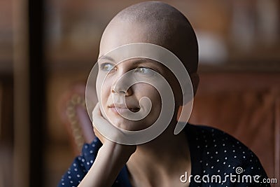 Positive thoughtful young hairless woman with cancer portrait Stock Photo