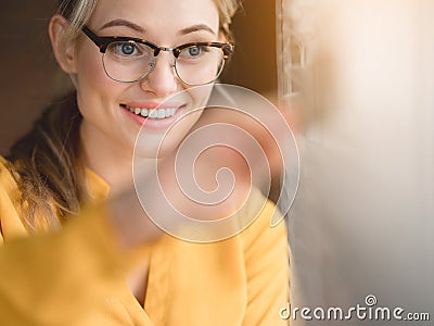 Positive woman fixing window louvers Stock Photo