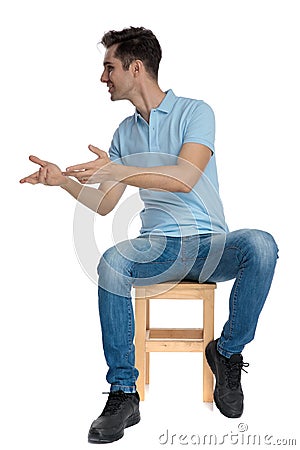 Positive young man explaing and gesturing Stock Photo