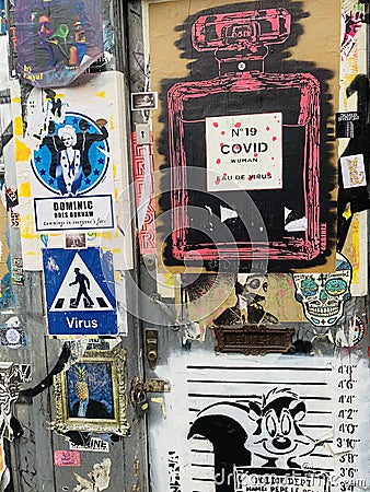 Famous streets of Brick lane where artists worldwide expose their street art sometimes mocking politicians and modern events like Editorial Stock Photo