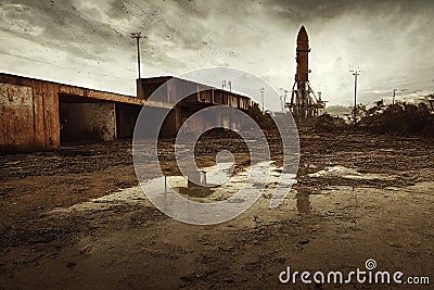 post Apocalyptic Nasa launch pad with old rusted Artamis 1 rock 80mm Lens abandoned cars overgrown puddles on asphalt apocalyptic Stock Photo