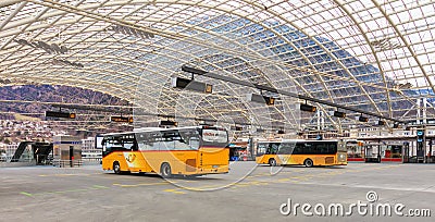 Post Buses at the bus station in the city of Chur in Switzerland Editorial Stock Photo