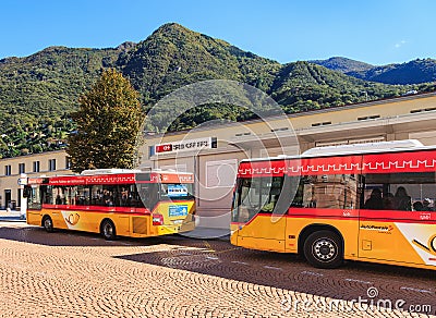 Post Buses in the city of Bellinzona, Switzerland Editorial Stock Photo