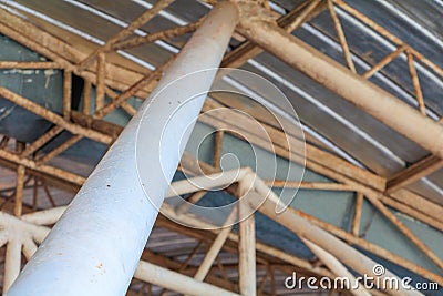 Post ceiling Metal Sheet old structure in building indoor Stock Photo