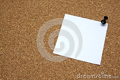 Post-it note with pushpin on corkboard Stock Photo