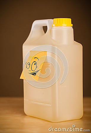 Post-it note with smiley face sticked on can Stock Photo