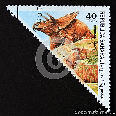 Triangle postage stamp 1997. Anchiceratop dinosaur Editorial Stock Photo