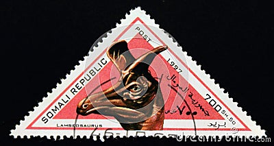Triangle postage stamp 1997. Lambeosaurus dinosaur Editorial Stock Photo