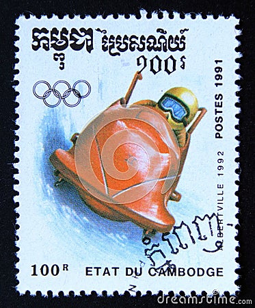 Postage stamp Cambodia 1991, Olympic Games bobsled Editorial Stock Photo