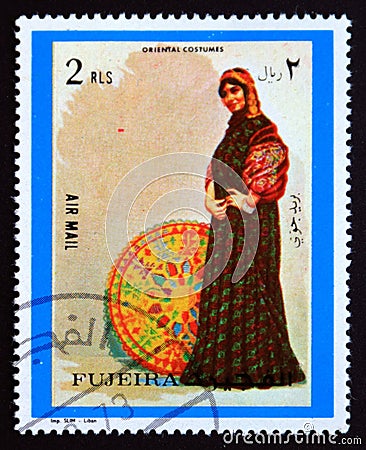 Postage stamp Fujairah, 1972, Oriental woman costume Editorial Stock Photo