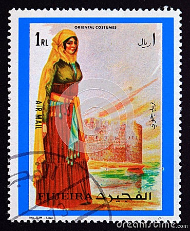 Postage stamp Fujairah, 1972, Oriental woman costume Editorial Stock Photo