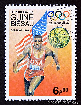 Postage stamp Guinea Bissau 1984, Olympic Winners Carl Lewis, 4x100 relay, USA Editorial Stock Photo
