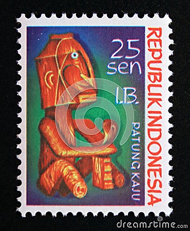 Postage stamp Indonesia West Irian 1970. Seated man wooden carved statue Editorial Stock Photo