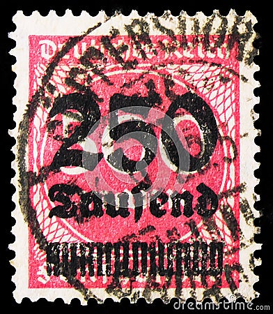Postage stamp printed in German Realm shows Surcharge - 250T on 500m (numbers), Inflation Series, 250000 German reichsmark, circa Editorial Stock Photo