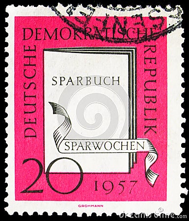 Postage stamp printed in Germany, Democratic Republic, shows Savings book, Thrift weeks serie, 20 Pf. - East German pfennig, circa Editorial Stock Photo