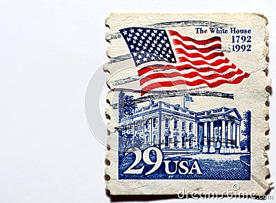 A postage stamp printed in the United States of America shows the waving American flag over the White House circa 1992 Editorial Stock Photo