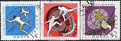 Postage stamps printed in the USSR with the a picture of fencing, and the inscription in Russian `World fencing championship, Mosc Editorial Stock Photo