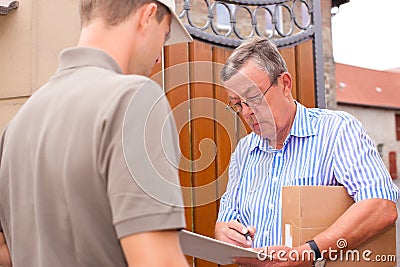 Postal service - delivery of a package Stock Photo