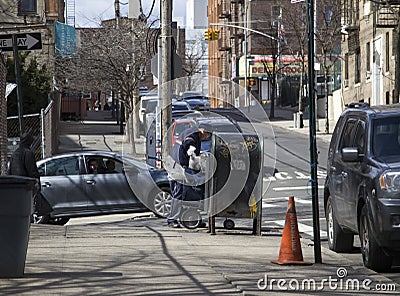 Postal worker empties mail box in Bronx NY community Editorial Stock Photo
