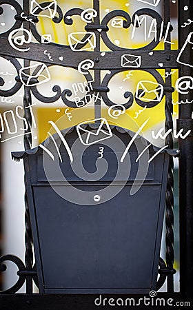 Postbox with white hand drawn mail icons Stock Photo