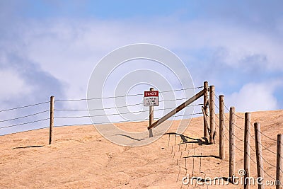 Posted sign on a edge of a cliff of Cape Kiwanda read `Danger` and `Do not go beyond this point` Stock Photo