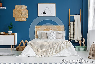 Poster in blue bedroom interior Stock Photo