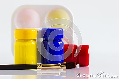 Poster colour bottle, paintbrush and palette on white background. Stock Photo