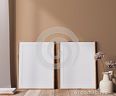 Poster frame mock up in neutral colors interior, two wooden frames with dried flowers vase in beige background Stock Photo