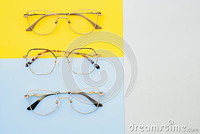 Poster of glasses on pastel background. Optics. Vision Stock Photo