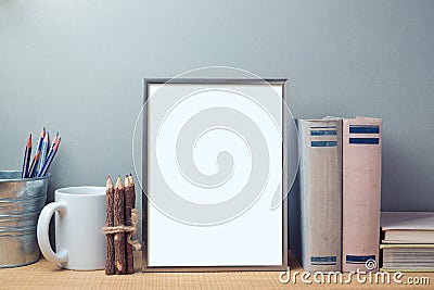 Poster mock up template with books and desk objects Stock Photo