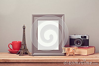 Poster mock up template with Eiffel Tower and vintage film camera. Travel and tourism Stock Photo